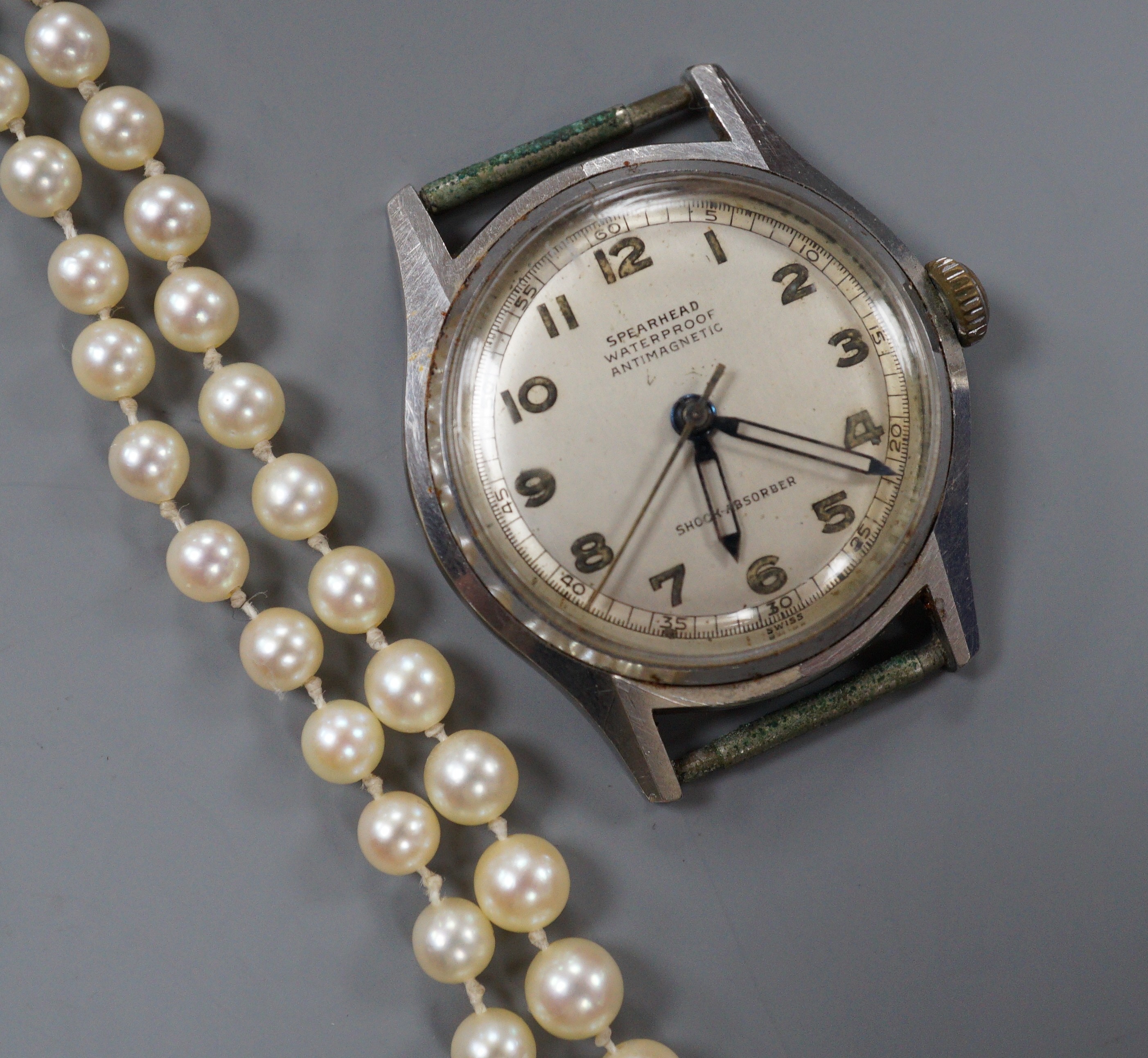 A single strand graduated cultured pearl necklace, with four stone diamond set white metal clasp, 50cm, gross weight 14.4 grams (pearls have not been tested).